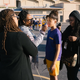 Kim Kimble (right) touches up star Storm Reid (second right) as director Ava DuVernay (left) and crew members look on.